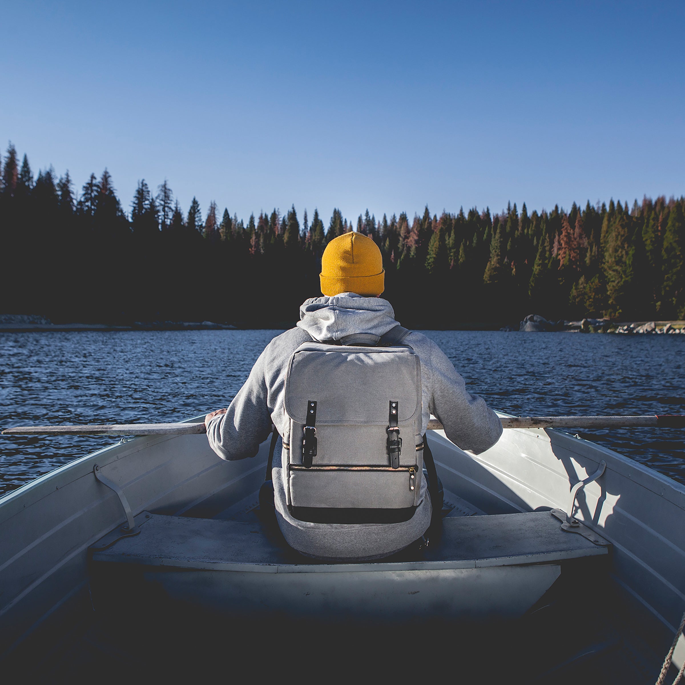 picnic time bar backpack man in boat